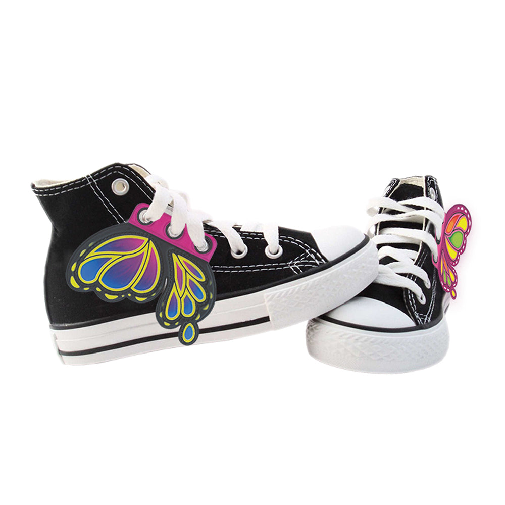 Pair of Black Converse shoes with a pair of Lace Wings attached. One Wing on each shoe.