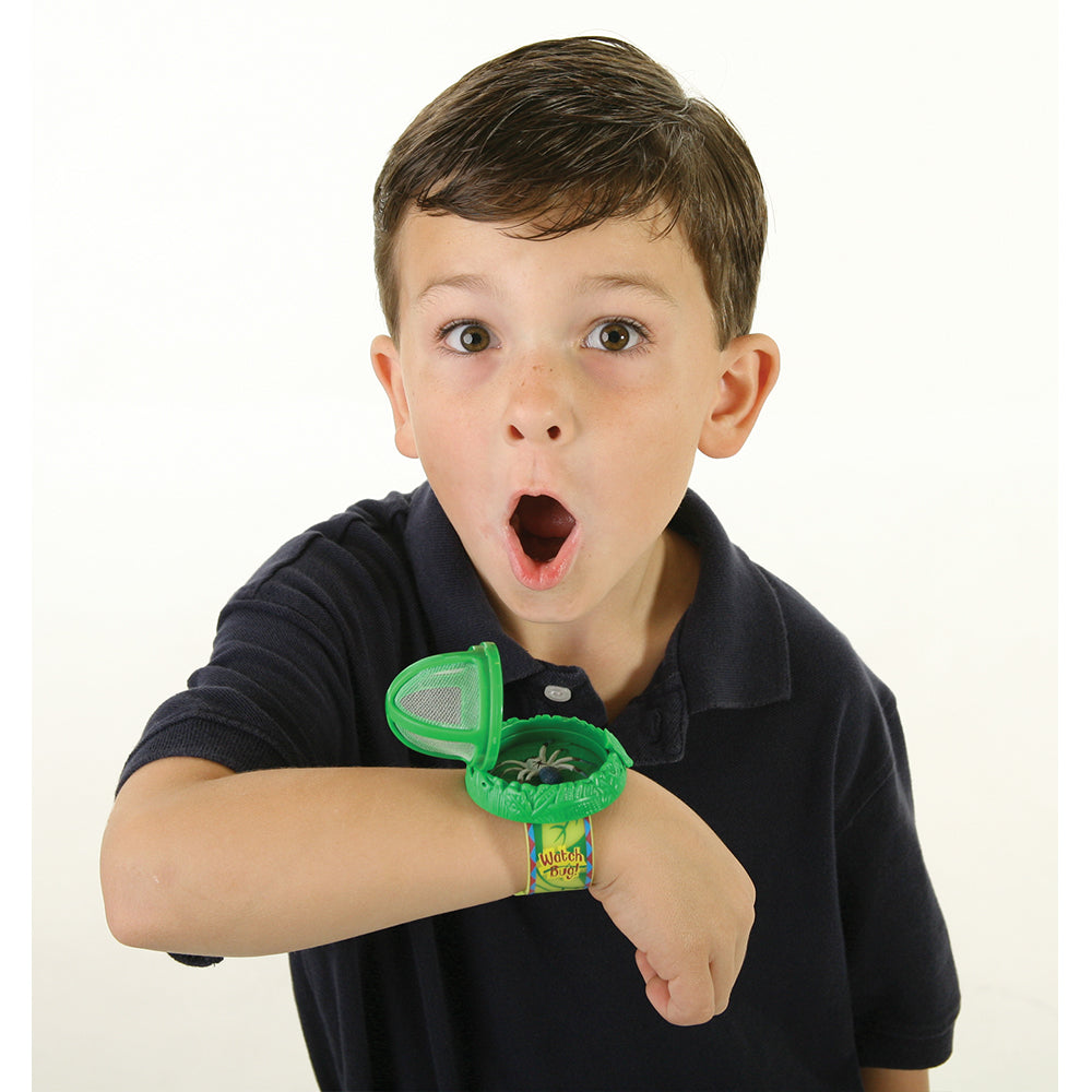 Young Boy wearing the Watch A Bug. Handy wrist habitat with rubber strap for taking critters on the go with you. Green.