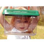 Young girl peering through the Observation house. Inside is a frog. 